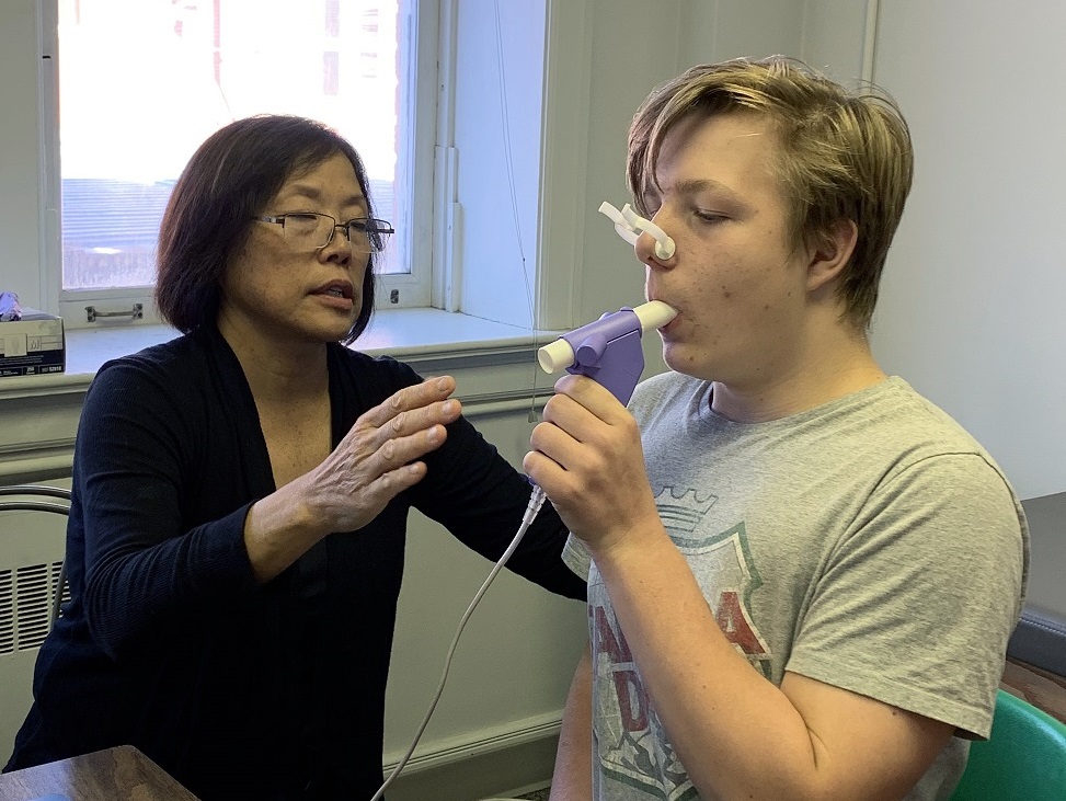 Edmonton: Site Coordinator Joyce Chikuma assists Jaimen with his spirometry test